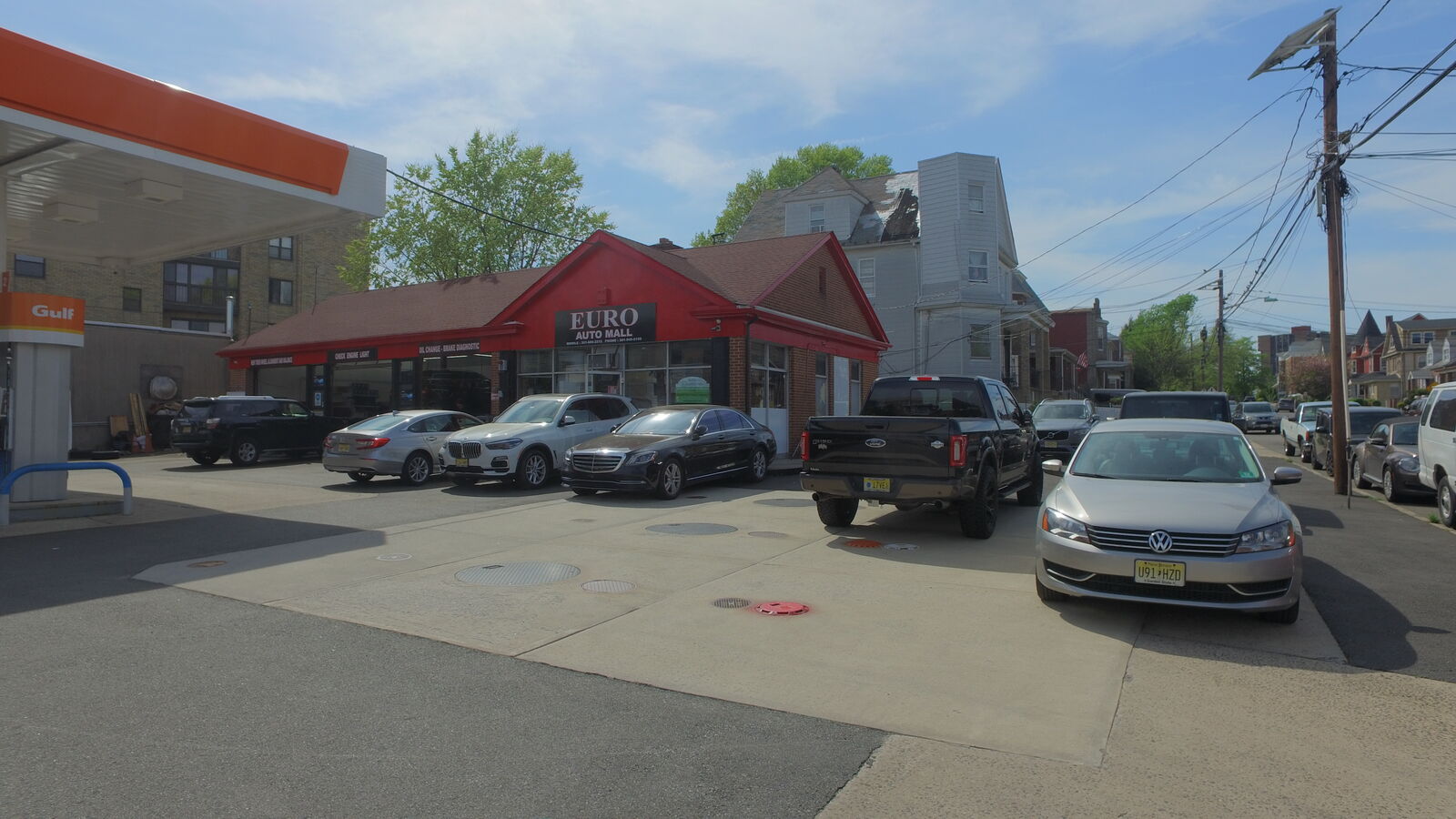Customer vehicles including BMW and Mercedes-Benz parked outside Euro Auto Mall